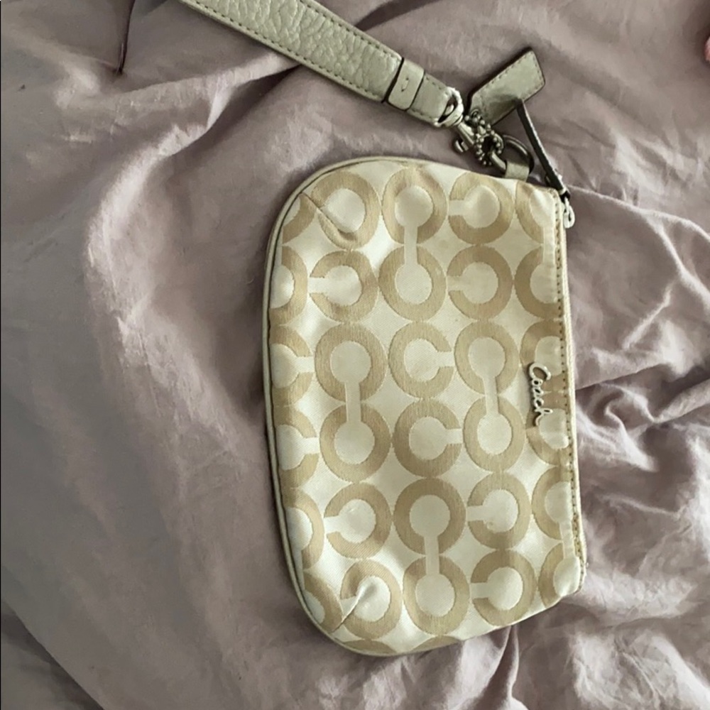 Women’s gold coach wristlet